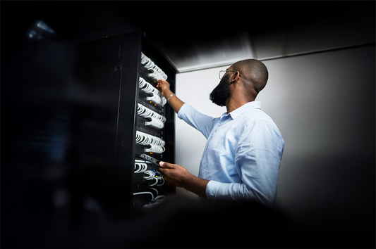 Black sneaker organizer with white laces and rubber soles for holiday prep
