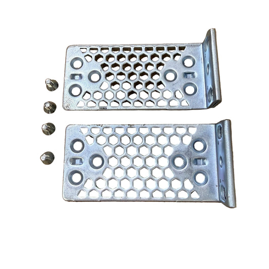 Two metal brackets with honeycomb pattern on a brown surface