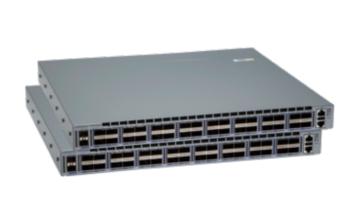 Stacked gray arista dcs-7050cx3-32c-dc-r 32-port 100g network switches with rear airflow and industrial design