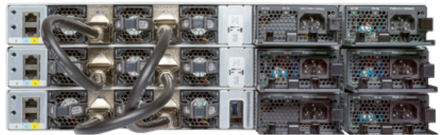 Black and silver cisco c9300-48p-e server rack back with multiple fans power ports and modular uplink network interfaces
