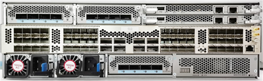 Silver-colored cisco ncs-57c3-mod-hx hardened router back side with multiple network ports and cooling fans in a server rack
